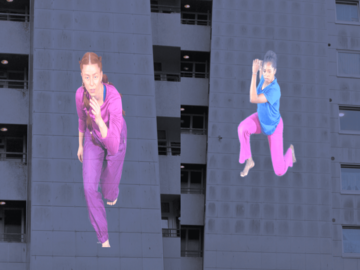 Projektion von 2 Tänzern auf Außenwand