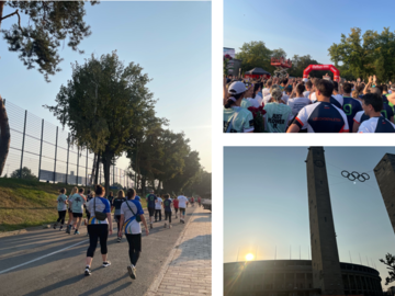 Läufer und Läuferinnen die in Richtung Olympiastadion laufen. 